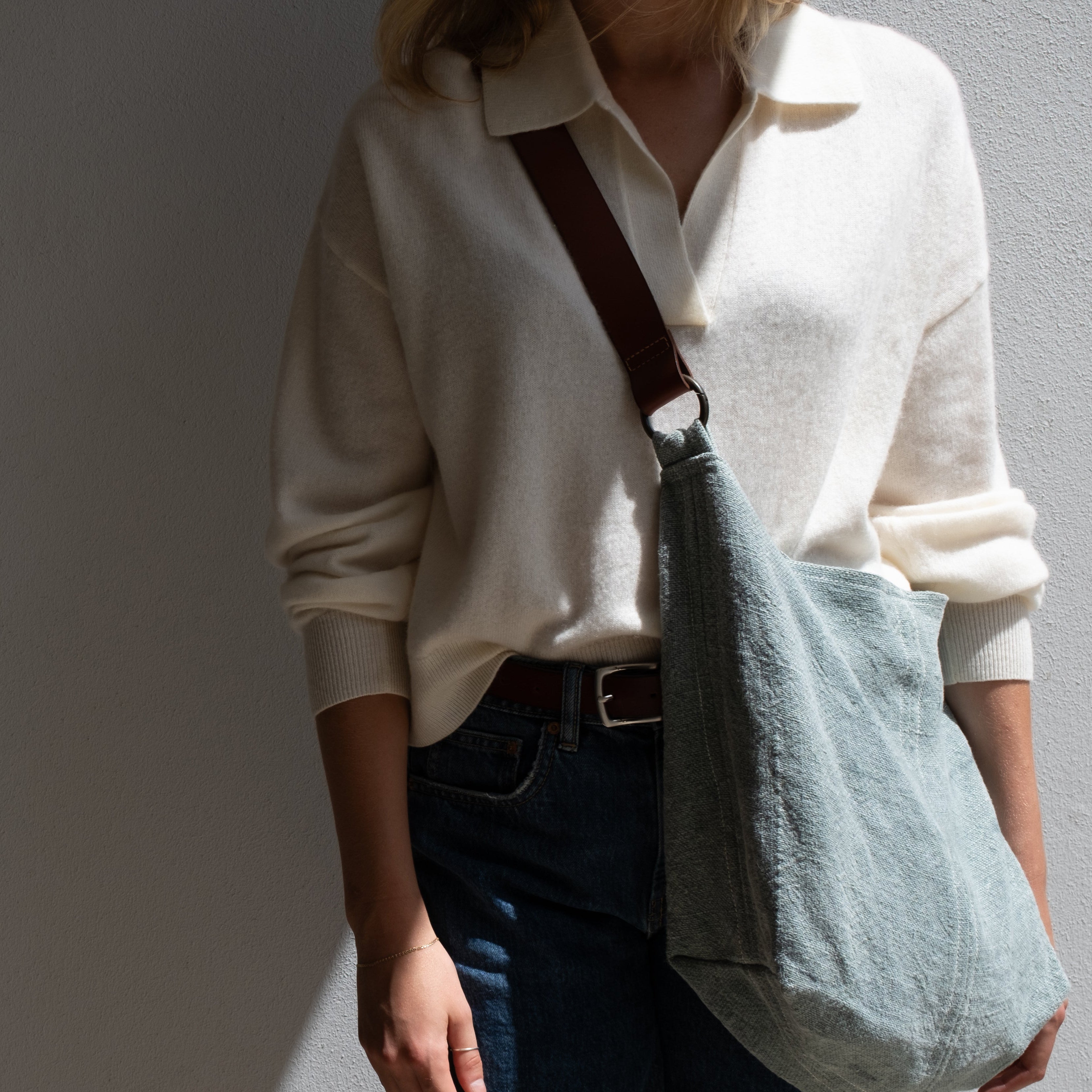 woman wearing blue jute bag